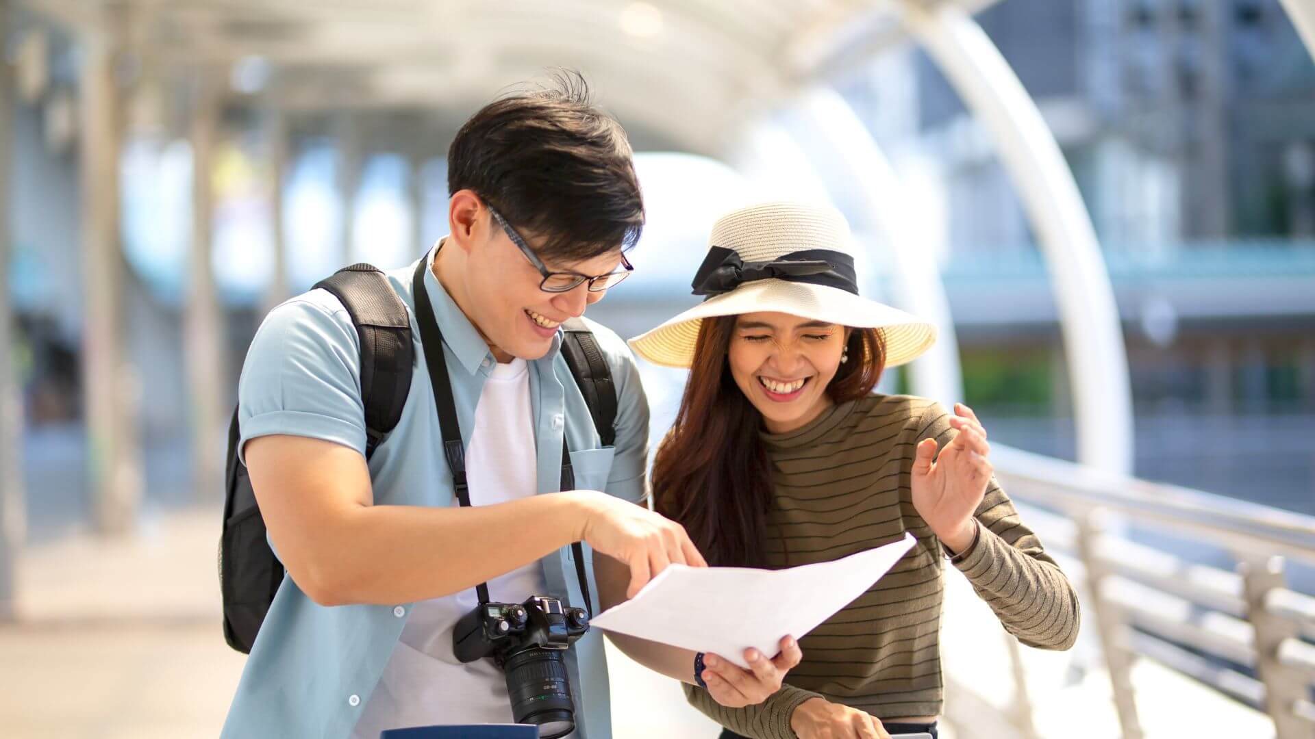 couple on vacation looking at a map
