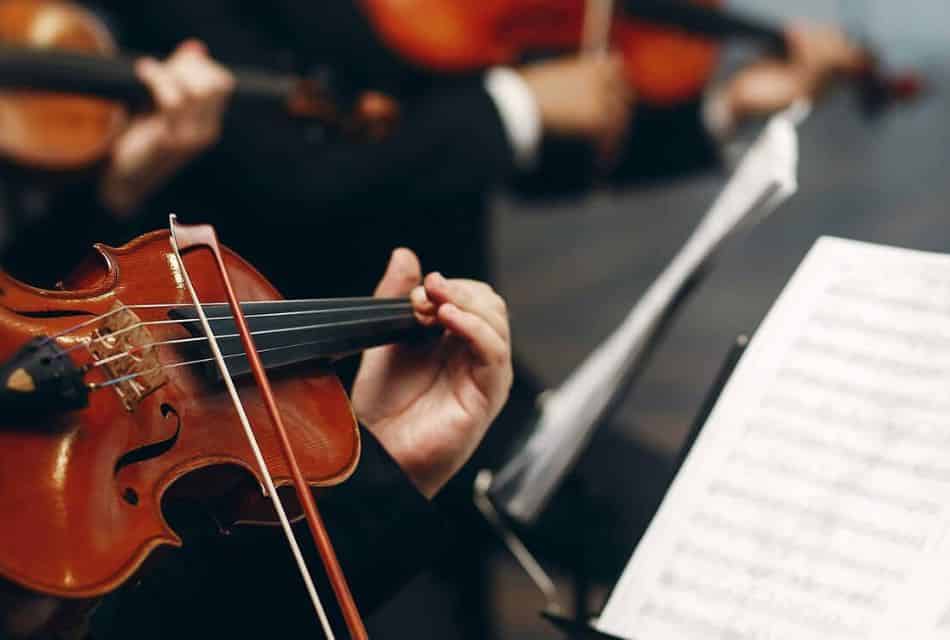 Close up view of a person playing a violin