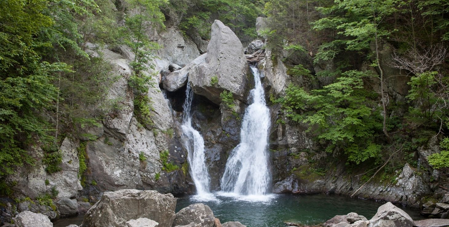 Twin waterfalls cascading down a granite rock face in the Berkshires of MA