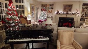 Christmas decor around the baby grand and sitting area at Devonfield Inn