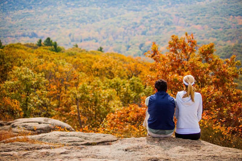 Couple on a hike taking in the autumn views