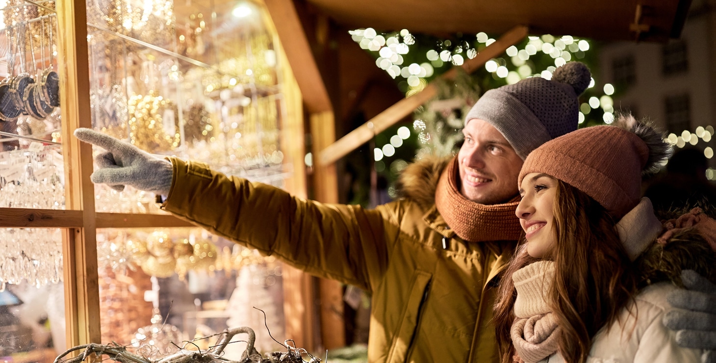 Happy couple window shopping at Christmas