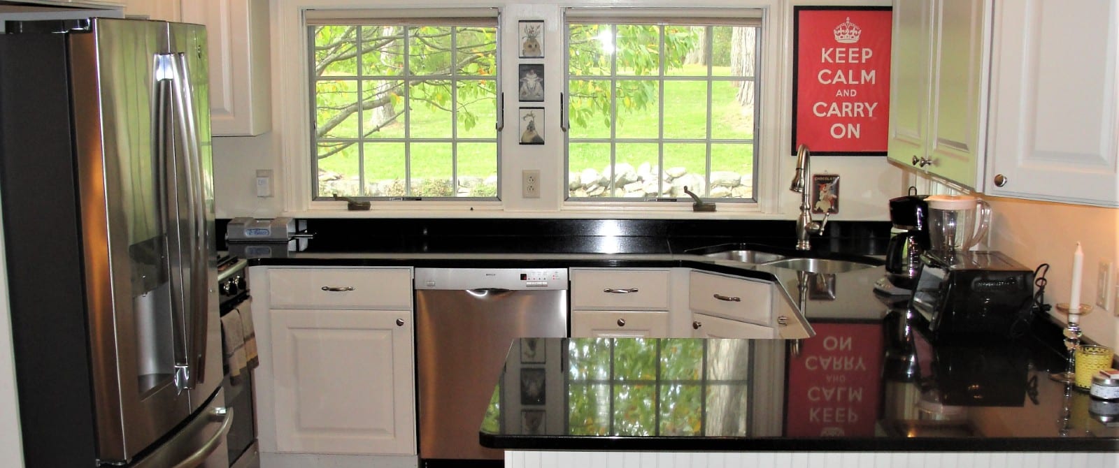 kitchen with black counter and silver appliances